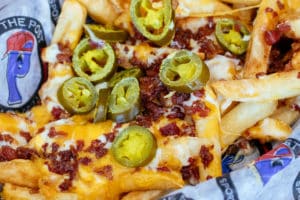 Loaded fries with cheddar jack cheese, bacon, and jalapenos
