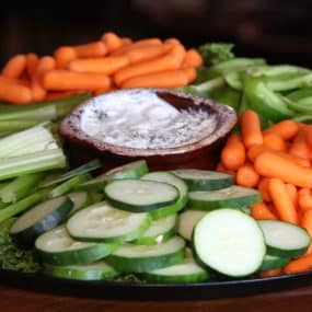 Veggie Catering Tray with Baby carrots, celery, cucumber, and green pepper and a French onion dip